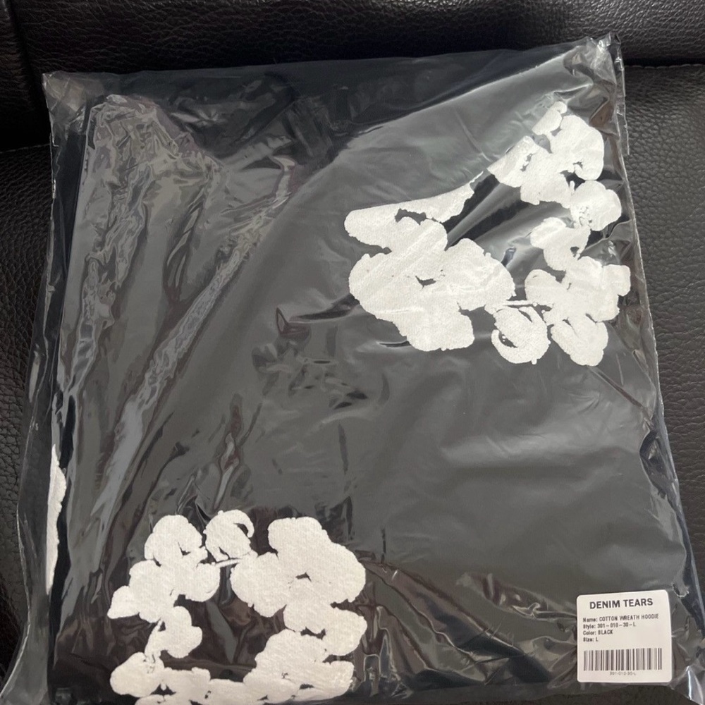 Denim Tears Black Hoodie with White Floral Design